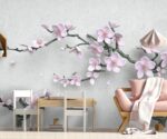 3D floral wallpaper mural featuring soft pink cherry blossom flowers and tree branches on a light grey background in a modern kids room setting.