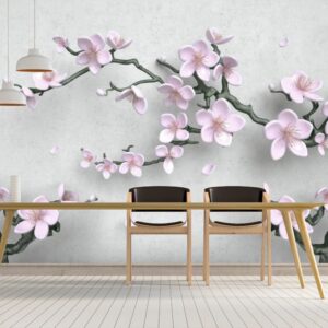3D floral wallpaper mural featuring soft pink cherry blossom flowers and tree branches on a light grey background in a modern kids room setting.
