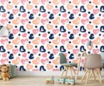 Colorful hearts wallpaper kids nursery mural featuring hand-painted brushstroke hearts in navy blue, peach, and pink with dark blue polka dots.