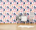 Colorful hearts wallpaper kids nursery mural featuring hand-painted brushstroke hearts in navy blue, peach, and pink with dark blue polka dots.