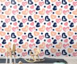 Colorful hearts wallpaper kids nursery mural featuring hand-painted brushstroke hearts in navy blue, peach, and pink with dark blue polka dots.