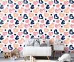 Colorful hearts wallpaper kids nursery mural featuring hand-painted brushstroke hearts in navy blue, peach, and pink with dark blue polka dots.