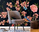 Dark floral wallpaper mural with pink roses, blossom branches, blue bird and butterflies on deep navy background.