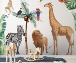 Safari animals wall decals for nursery featuring a giraffe, zebra, and monkey with tropical birds and palm trees above a white crib.