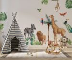 Safari animals wall decals for nursery featuring a giraffe, zebra, and monkey with tropical birds and palm trees above a white crib.